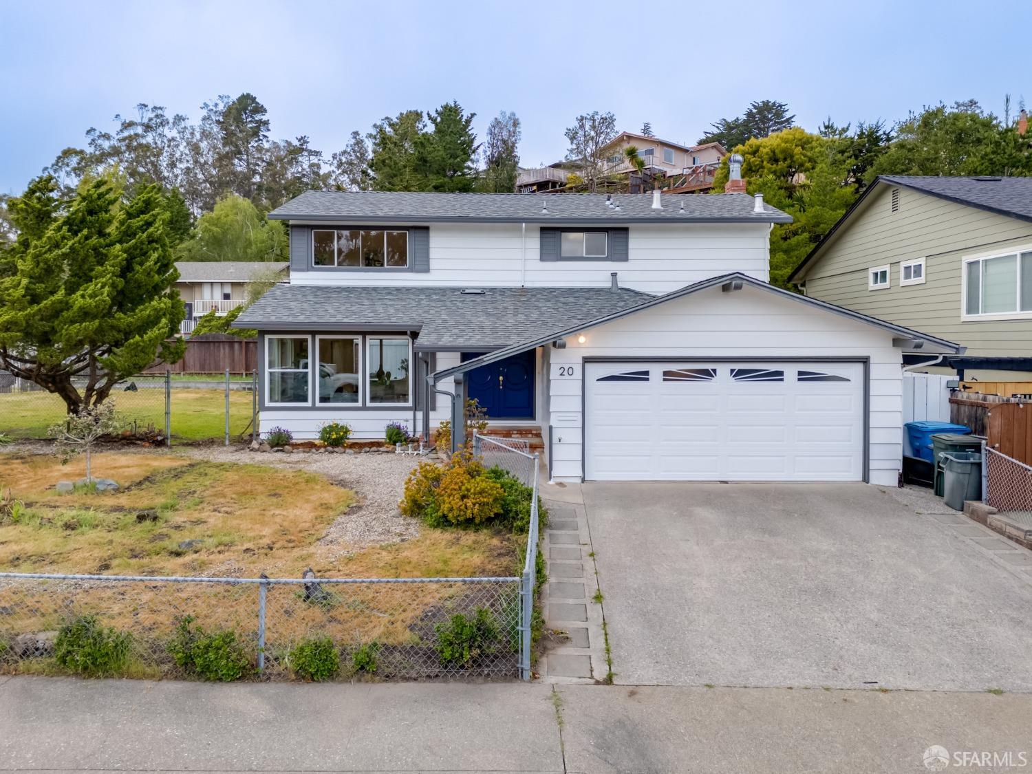 20 Point Reyes Way Pacifica, CA 94044 - Photo 77 of 78 a front view of a house with a yard and garage