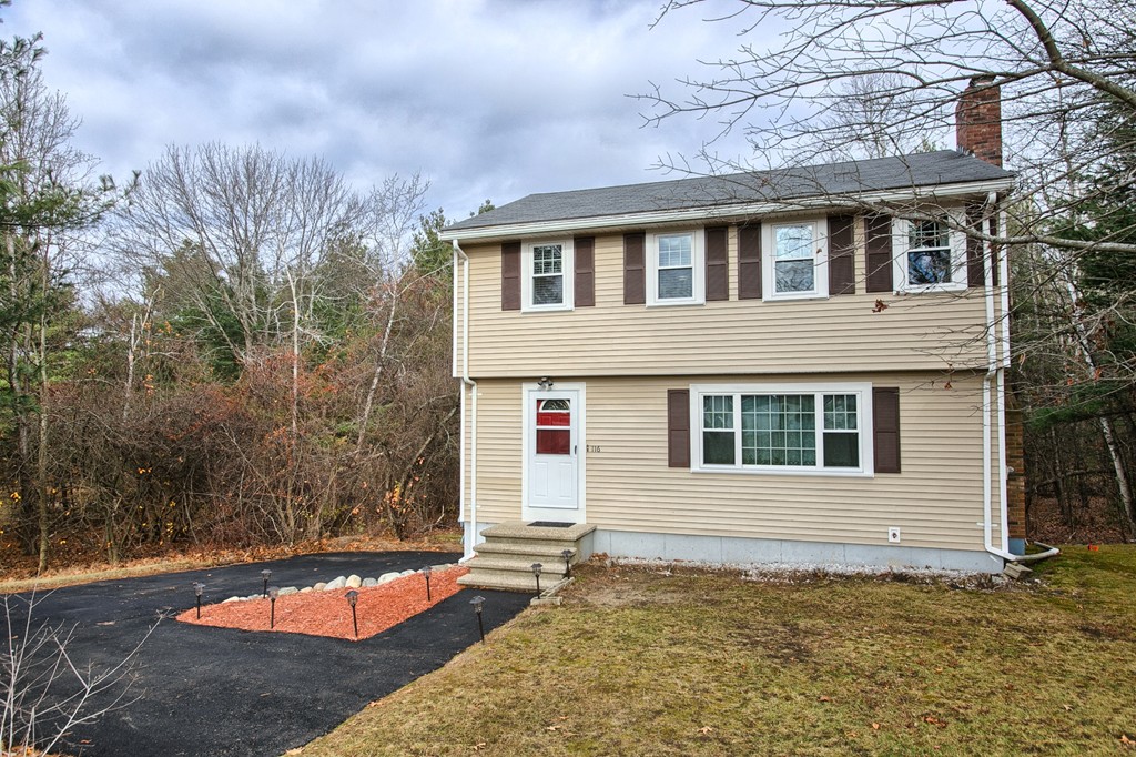 116 Crooked Spring Road Chelmsford, MA 01863 - Photo 3 of 24 a house with trees in front of it