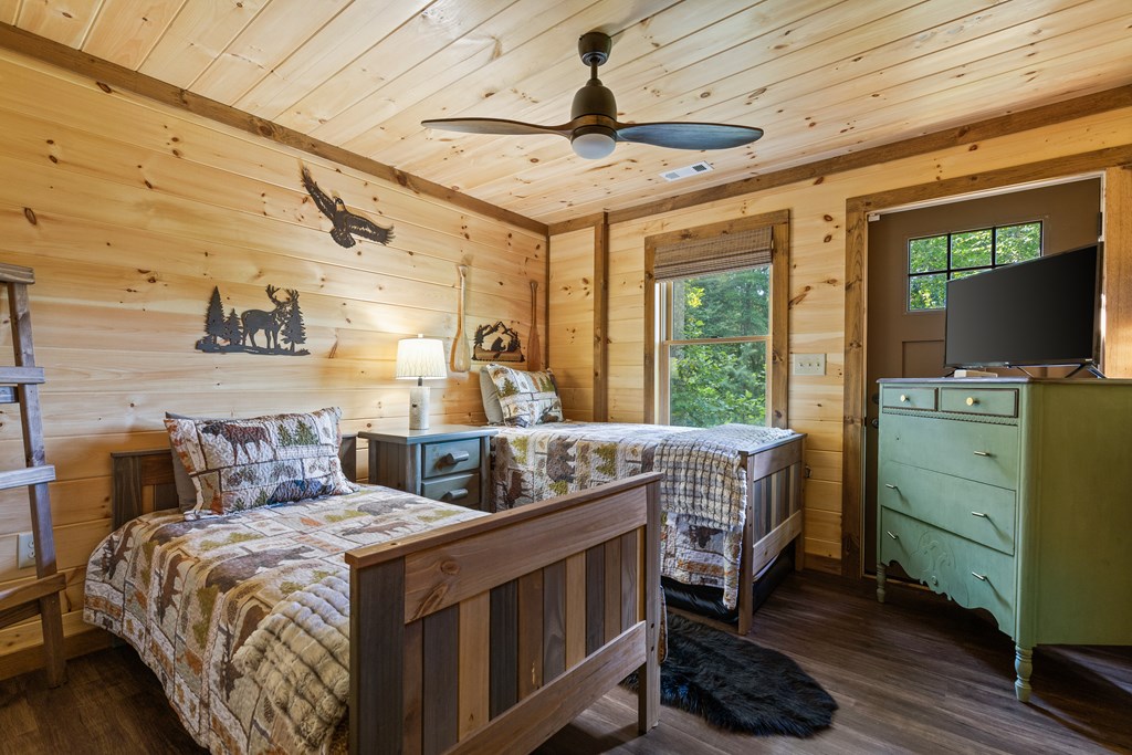 89 Whispering Hawk Trail Morganton, GA 30560 - Photo 15 of 33 a bedroom with a bed and a desk