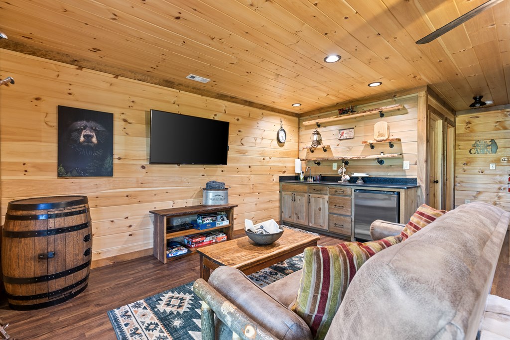 89 Whispering Hawk Trail Morganton, GA 30560 - Photo 17 of 33 a living room with furniture and a flat screen tv