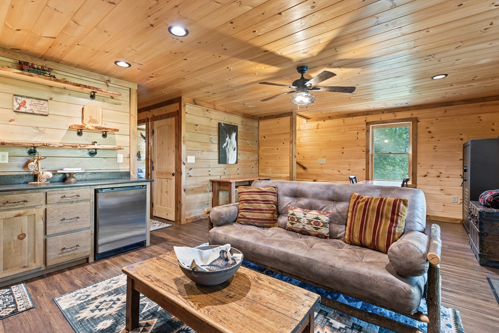 89 Whispering Hawk Trail Morganton, GA 30560 - Photo 19 of 33 a living room with furniture fireplace and a large window