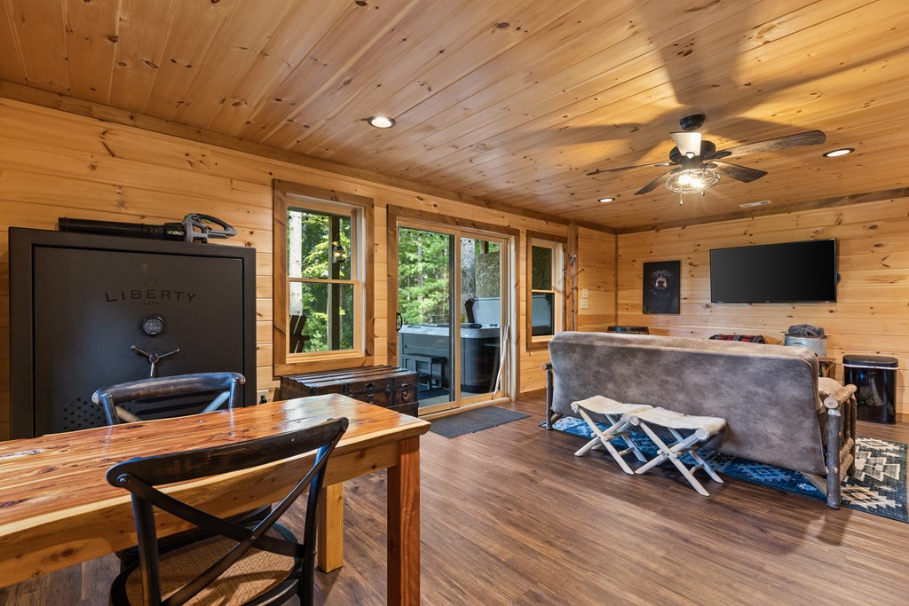 89 Whispering Hawk Trail Morganton, GA 30560 - Photo 20 of 33 a living room with furniture and a flat screen tv