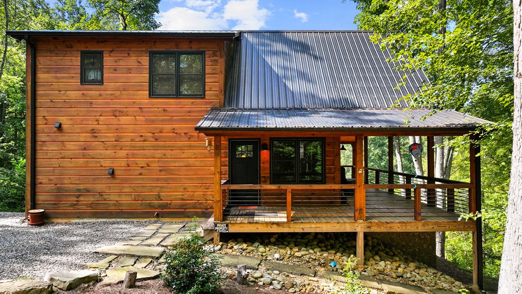 89 Whispering Hawk Trail Morganton, GA 30560 - Photo 2 of 33 a view of a house with a window