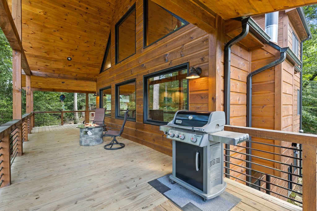89 Whispering Hawk Trail Morganton, GA 30560 - Photo 25 of 33 a view of a chairs and table in the patio next to a yard