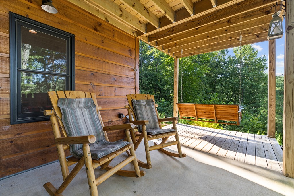 89 Whispering Hawk Trail Morganton, GA 30560 - Photo 27 of 33 a view of a chairs and table in the patio