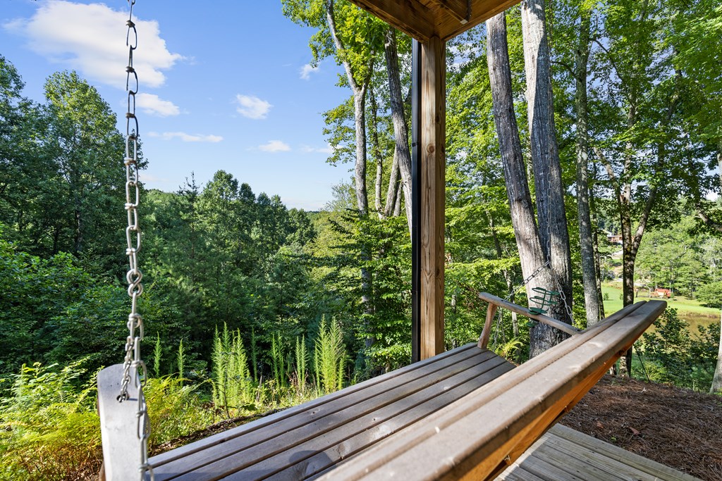 89 Whispering Hawk Trail Morganton, GA 30560 - Photo 30 of 33 a view of balcony with floor to ceiling windows and wooden fence