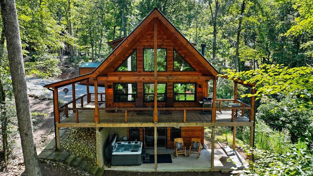 89 Whispering Hawk Trail Morganton, GA 30560 - Photo 3 of 33 a front view of a house with balcony