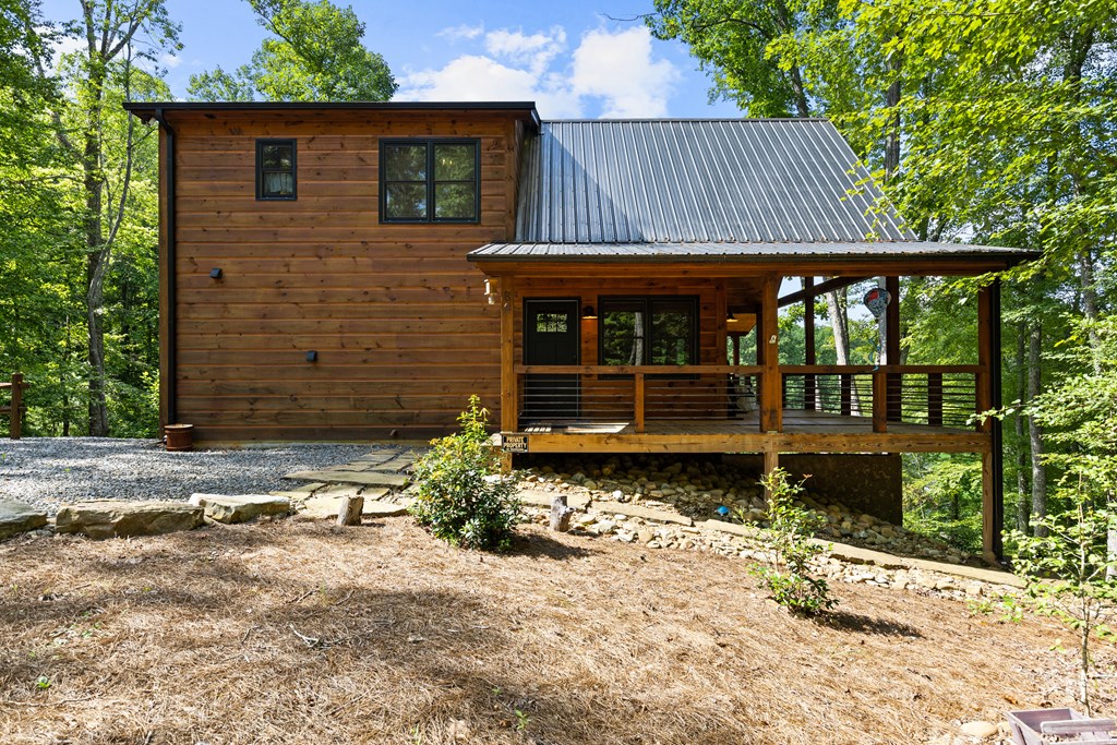 89 Whispering Hawk Trail Morganton, GA 30560 - Photo 32 of 33 a front view of a house with garden