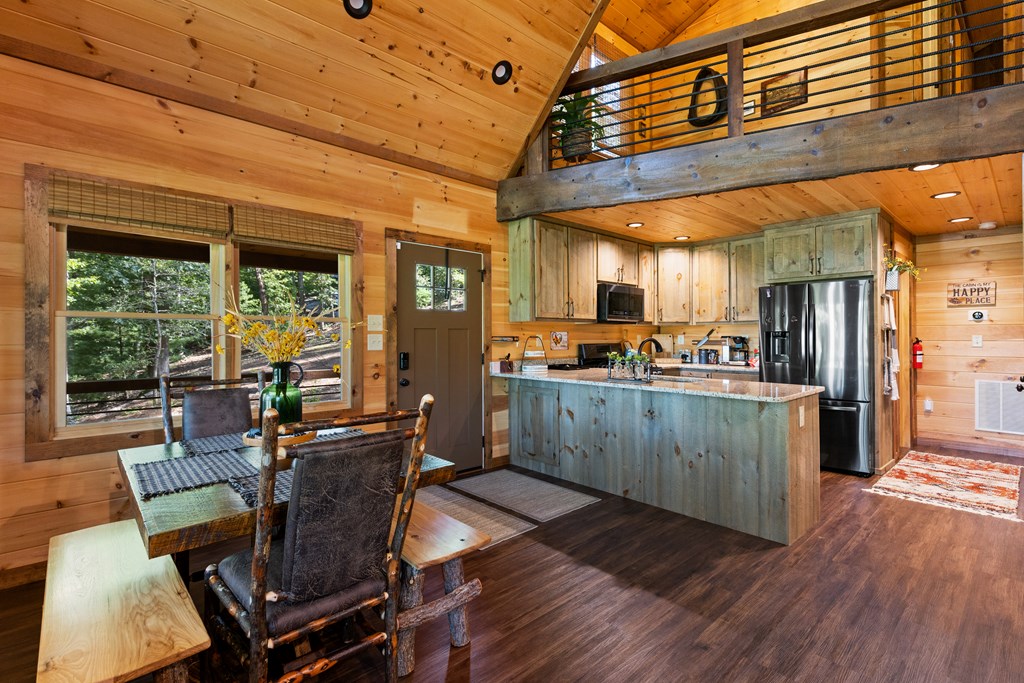 89 Whispering Hawk Trail Morganton, GA 30560 - Photo 8 of 33 a view of a dining room with furniture window and wooden floor