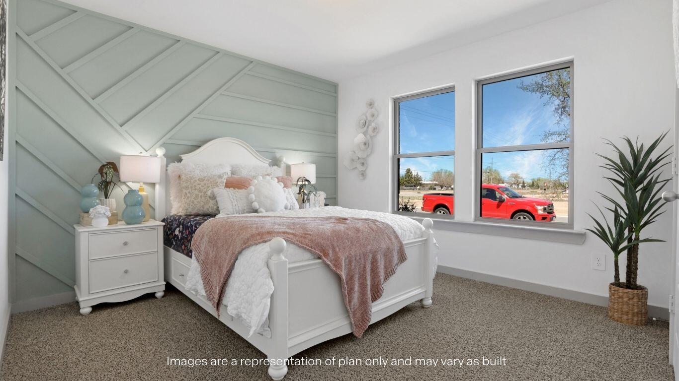 7815 94th Street Lubbock, TX 79424 - Photo 12 of 15 a bed room with a bed and a plant