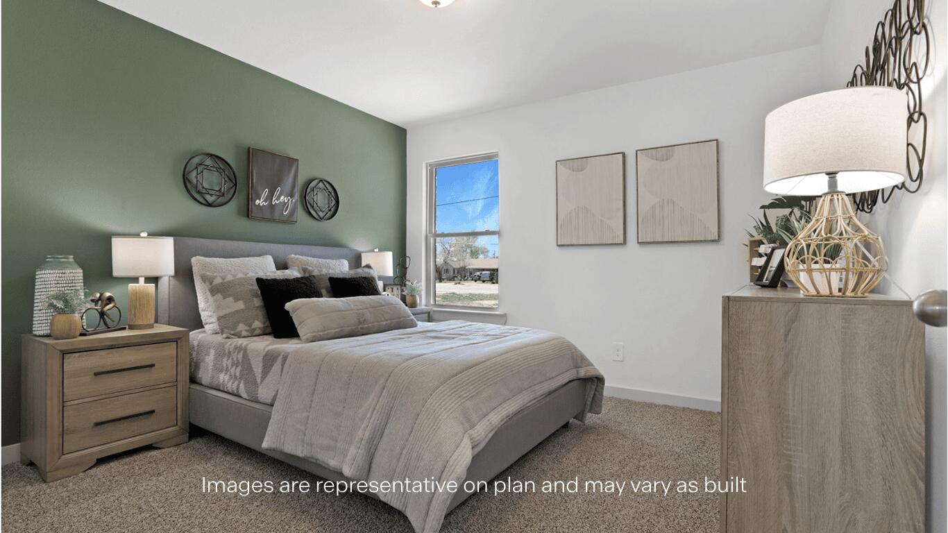 7815 94th Street Lubbock, TX 79424 - Photo 15 of 15 a bedroom with a bed and a lamp on dresser