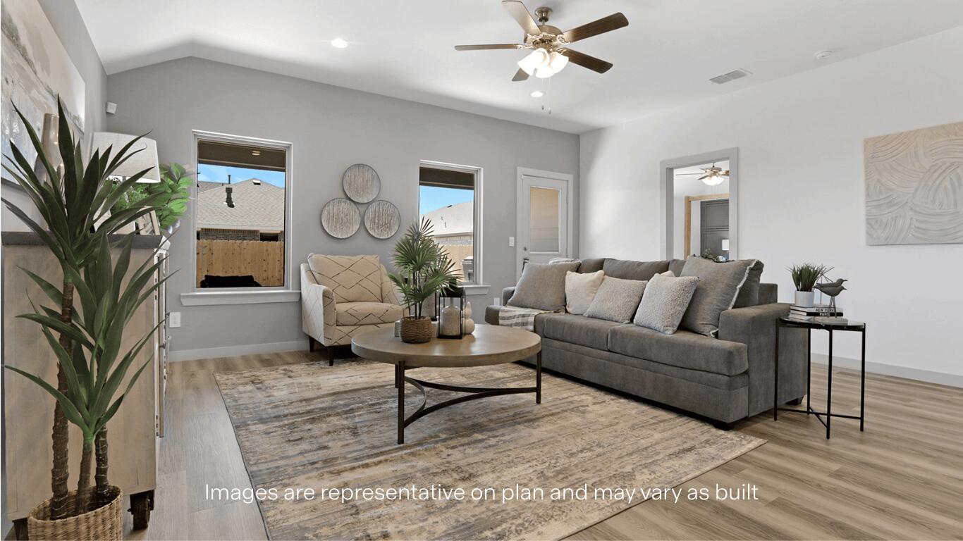 7815 94th Street Lubbock, TX 79424 - Photo 5 of 15 a living room with furniture and a clock