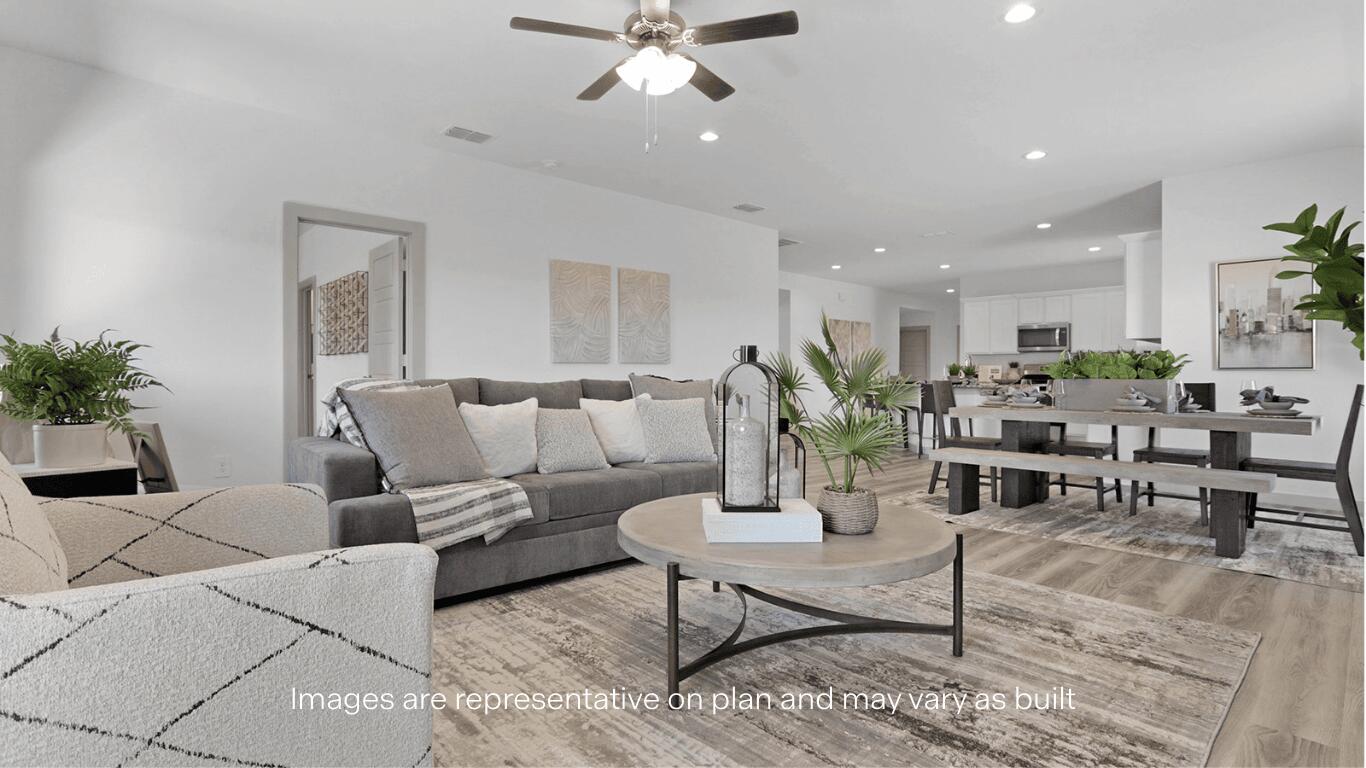 7815 94th Street Lubbock, TX 79424 - Photo 7 of 15 a living room with furniture kitchen view and a chandelier