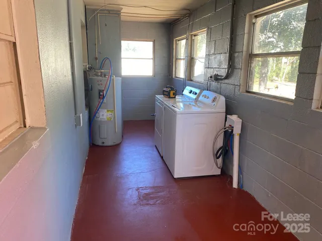 a view of a storage & utility room with a window