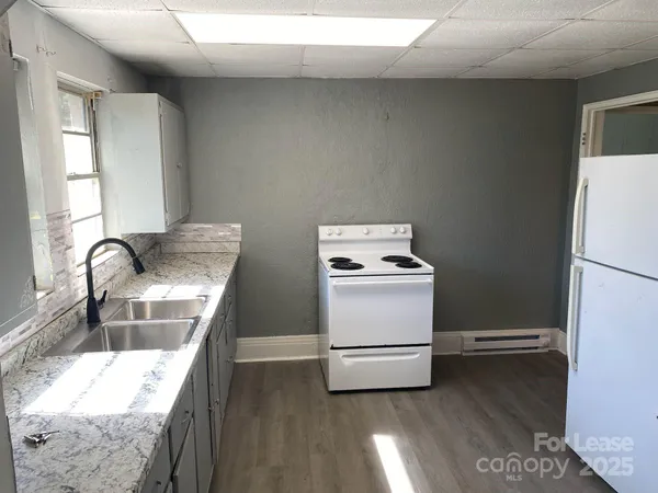 a kitchen with a stove and a sink