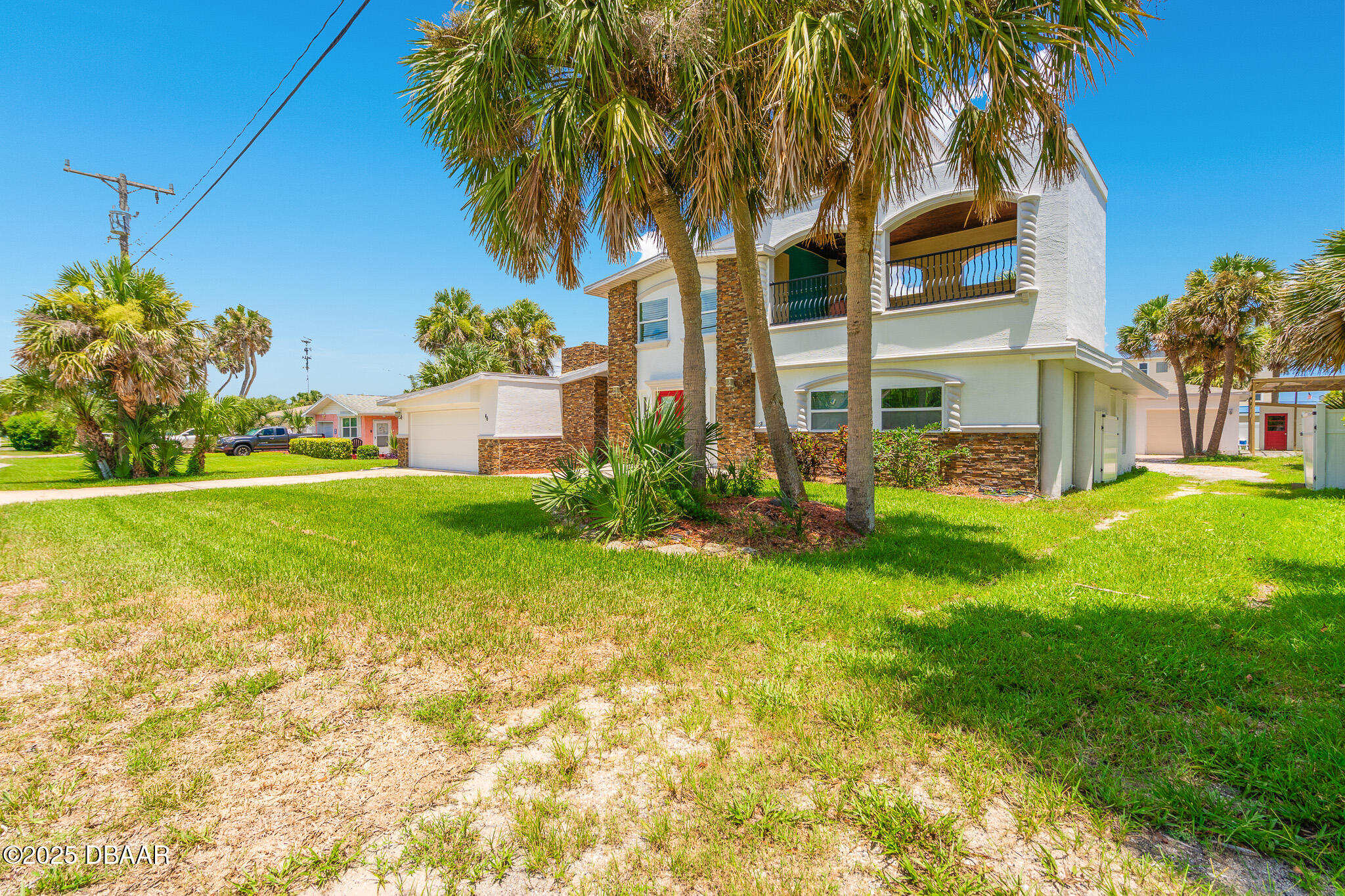 46 Oceanview Avenue Ponce Inlet, FL 32127 - Photo 69 of 79 a front view of a house with garden