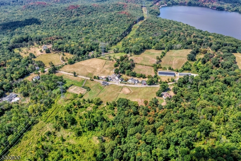 23 Charlottesburg Road Boonton, NJ 07005 - Photo 7 of 26 an aerial view of residential house with outdoor space and trees all around