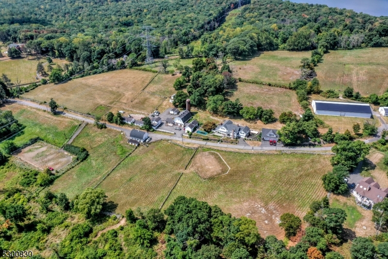 23 Charlottesburg Road Boonton, NJ 07005 - Photo 8 of 26 an aerial view of a house with a swimming pool