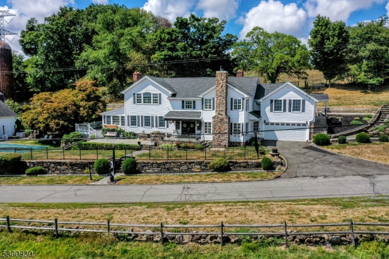 23 Charlottesburg Road Boonton, NJ 07005 - Photo 10 of 26 front view of a house with a yard