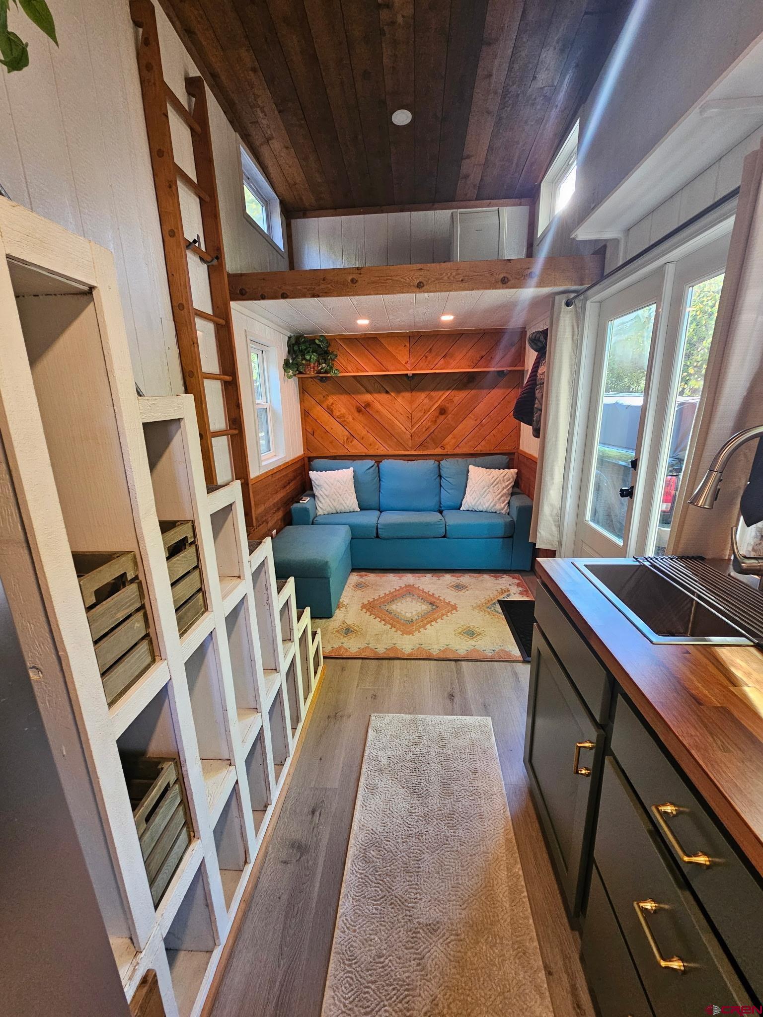 485 Florida Road, Unit C17 Durango, CO 81301 - Photo 8 of 11 a room with wooden floors and furniture