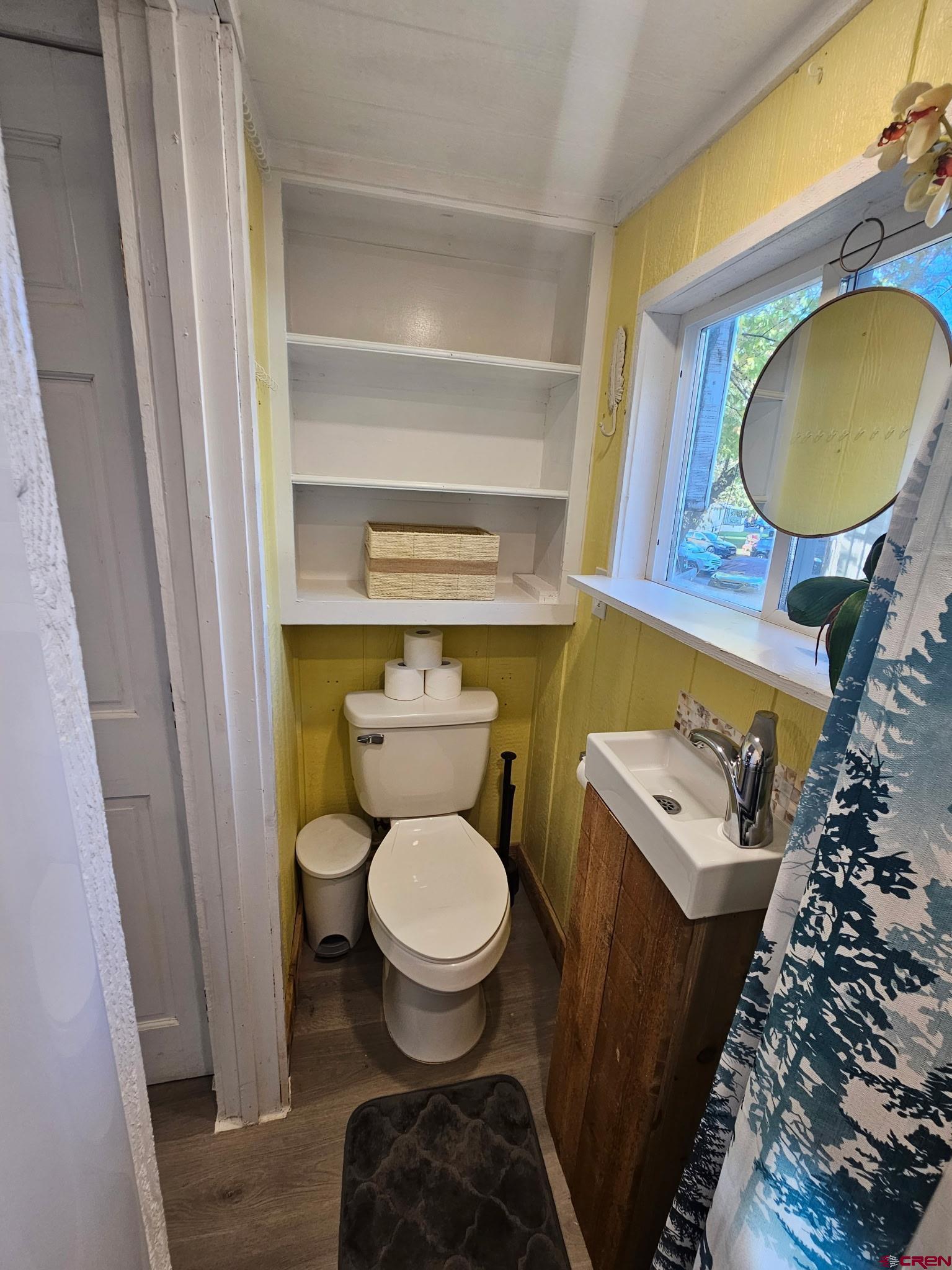 485 Florida Road, Unit C17 Durango, CO 81301 - Photo 9 of 11 a bathroom with a toilet and a mirror