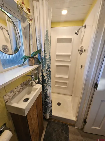 a view of the house with a yard