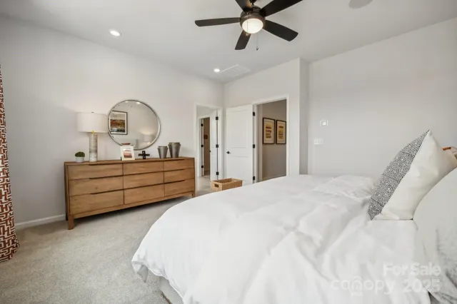 a view of a room with wooden floor and white walls