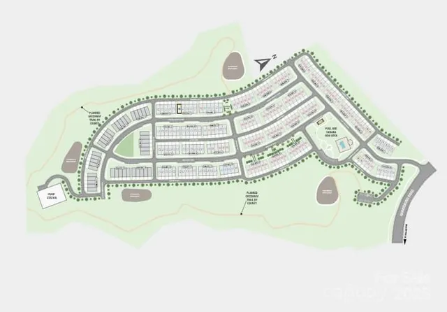 an aerial view of a house with a garden and houses