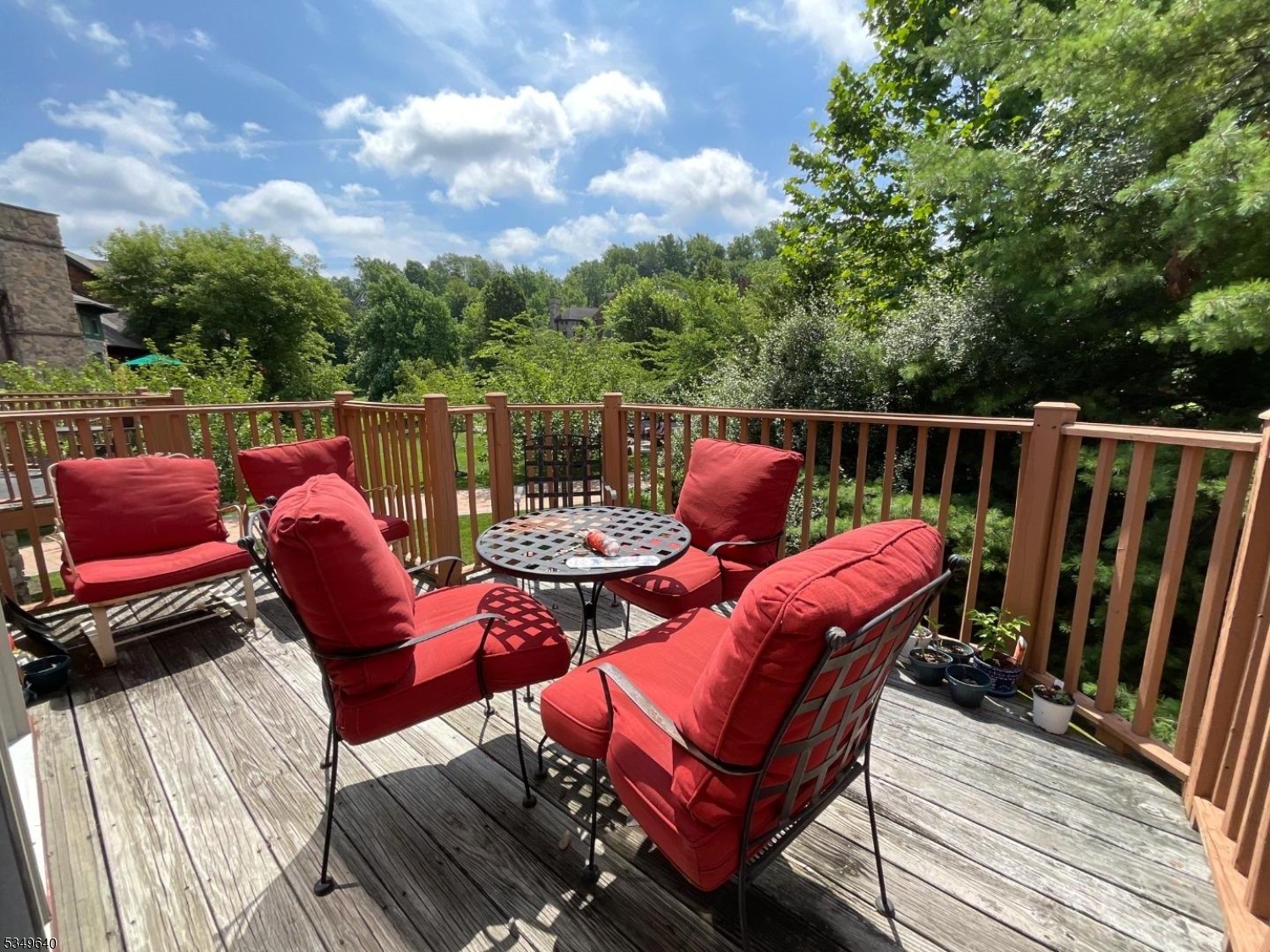 4-21 Maple Crescent, Unit 22 Vernon, NJ 07462 - Photo 17 of 25 a balcony with wooden floor and outdoor seating