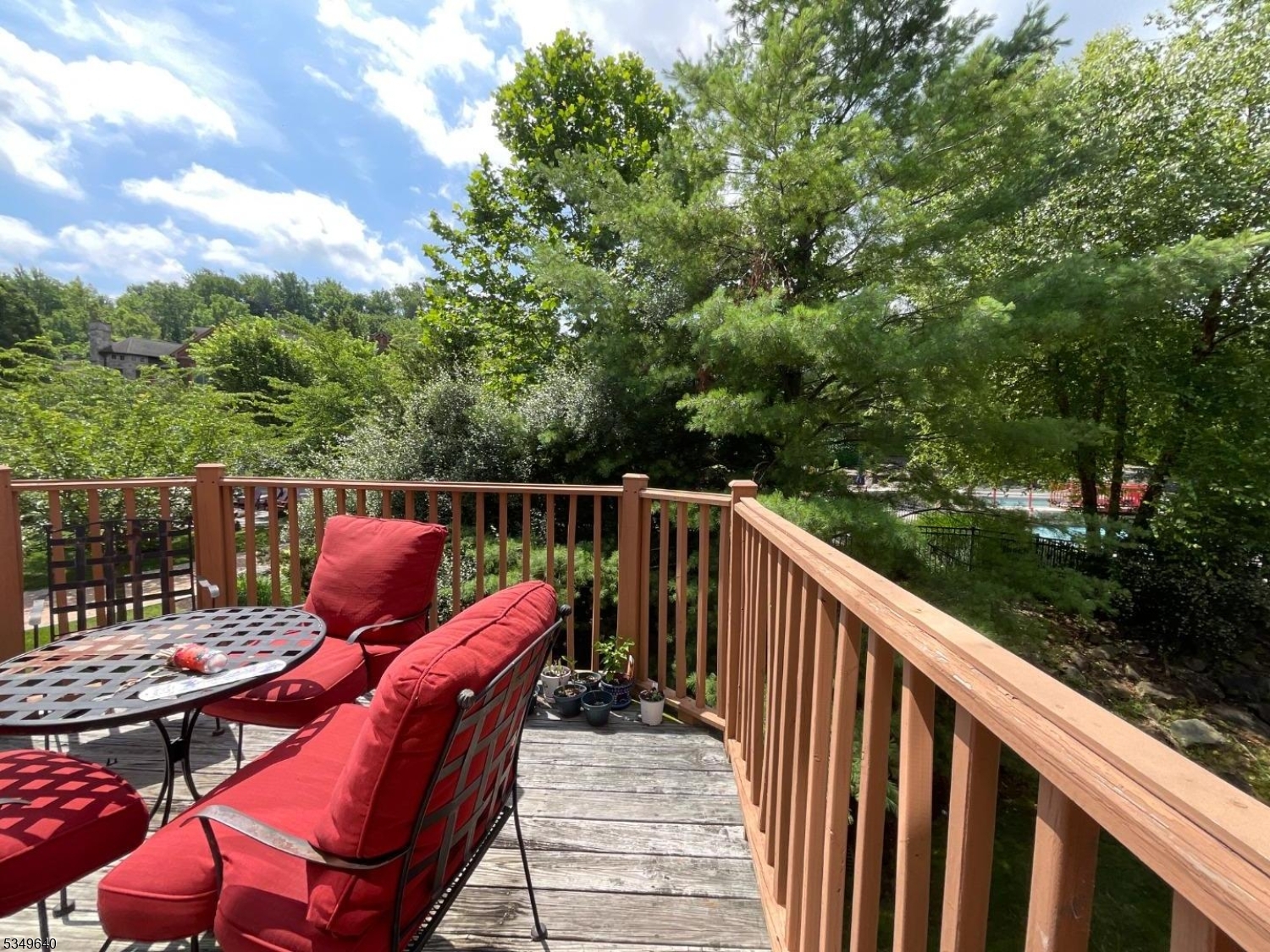 4-21 Maple Crescent, Unit 22 Vernon, NJ 07462 - Photo 18 of 25 a balcony with wooden floor and outdoor space