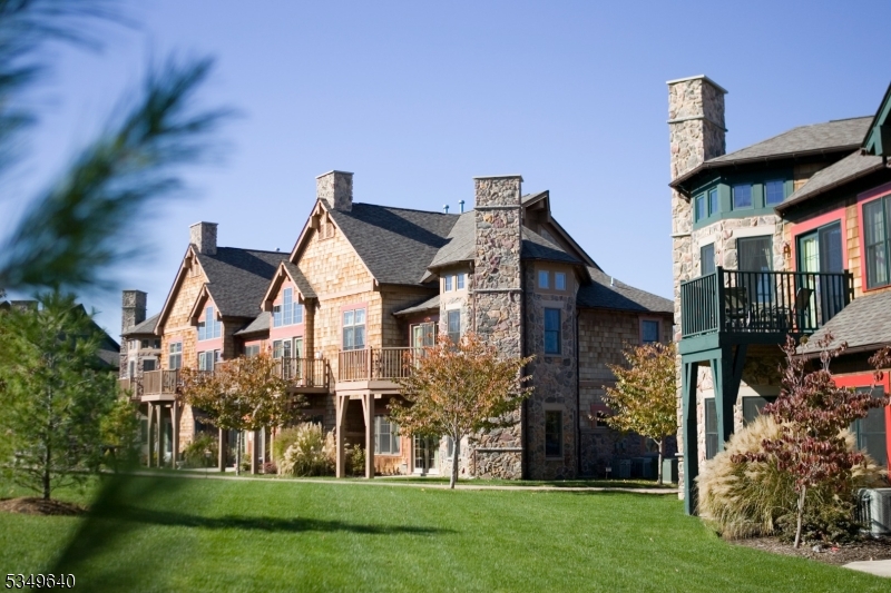 4-21 Maple Crescent, Unit 22 Vernon, NJ 07462 - Photo 19 of 25 a front view of house with yard and green space