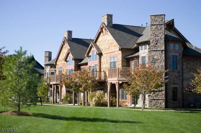 a front view of a house with swimming pool