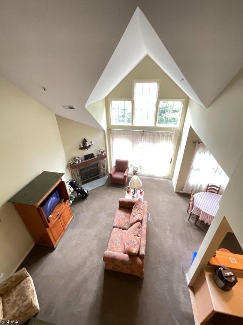 4-21 Maple Crescent, Unit 22 Vernon, NJ 07462 - Photo 7 of 25 a living room with furniture and a window