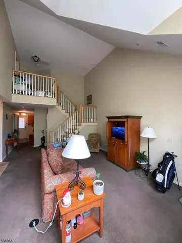 a very nice looking room with furniture and a lamp