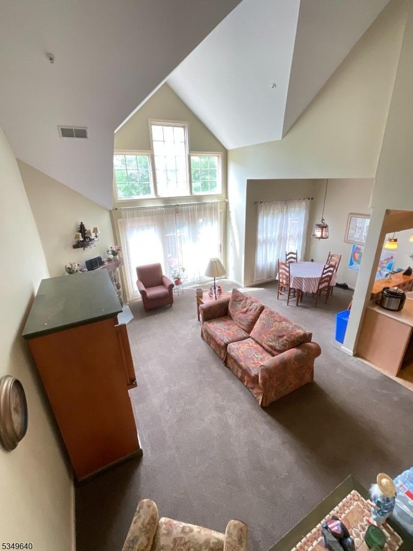 4-21 Maple Crescent, Unit 22 Vernon, NJ 07462 - Photo 9 of 25 a living room with furniture and a large window