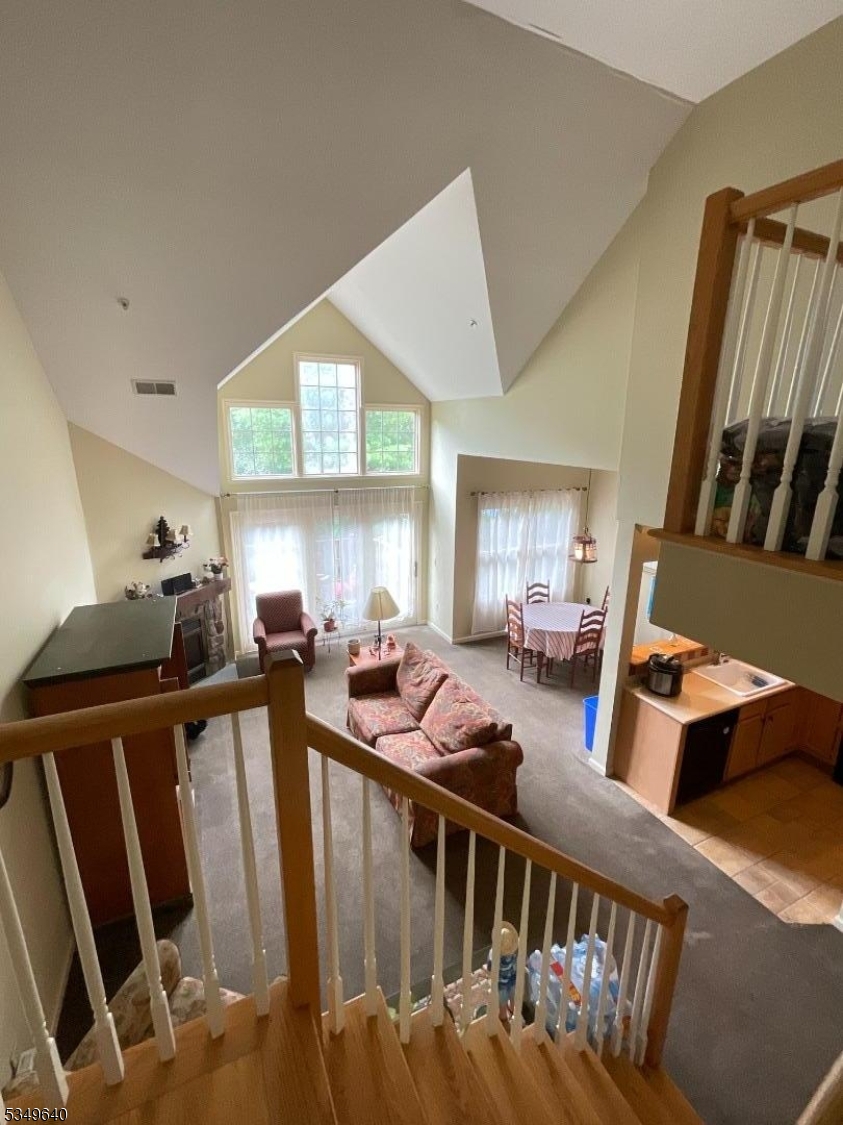 4-21 Maple Crescent, Unit 22 Vernon, NJ 07462 - Photo 10 of 25 a view of a livingroom with furniture hardwood floor and windows