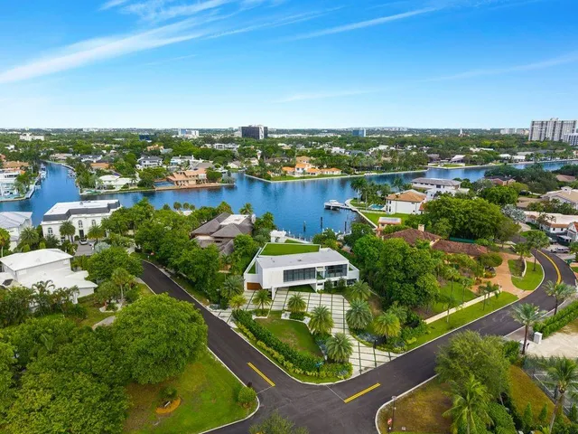 an aerial view of lake and houses with outdoor space