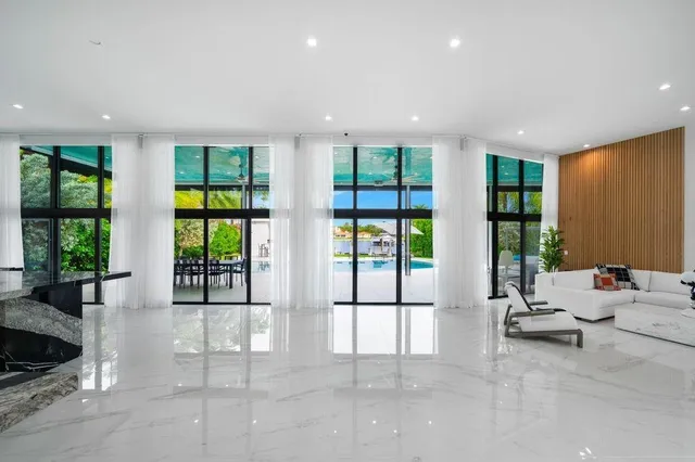 a view of front door with ceiling light and hardwood floor