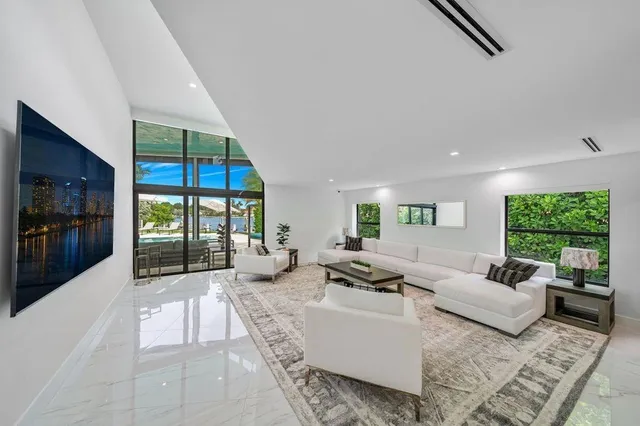 a spacious bedroom with a large bed and a window