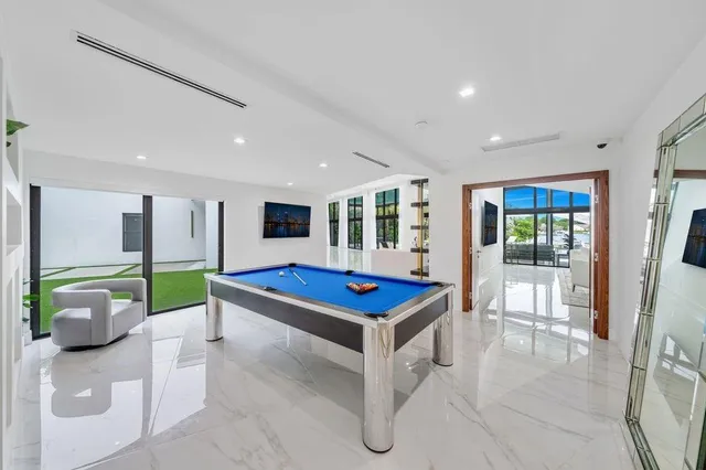 a view of a livingroom with furniture and a flat screen tv