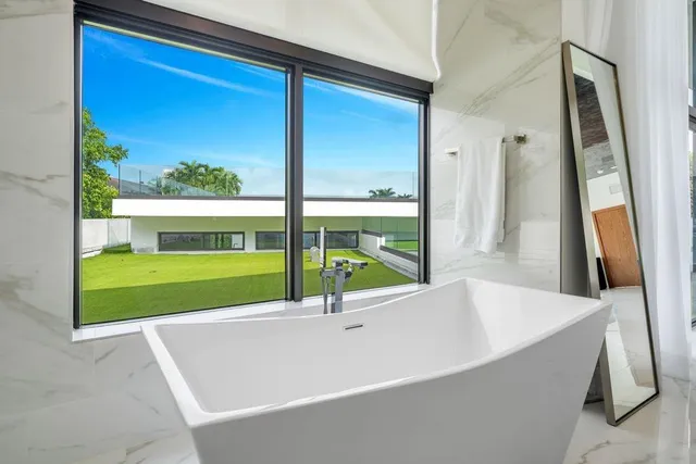 a view of house with backyard porch and outdoor seating