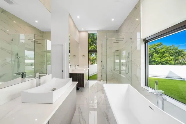 a swimming pool with outdoor seating and yard