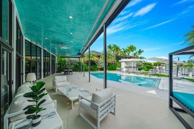 a view of a swimming pool with a patio