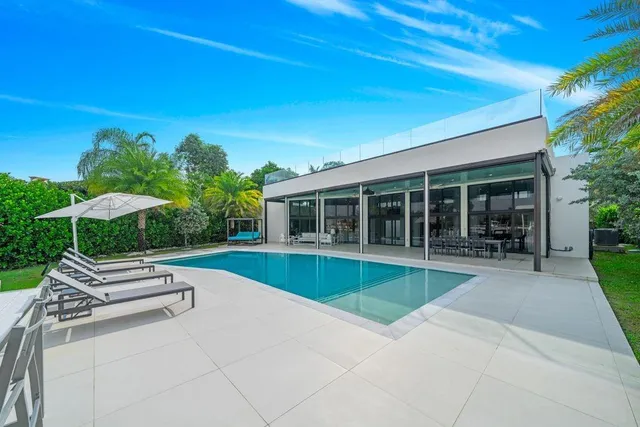 a view of a swimming pool and a chairs