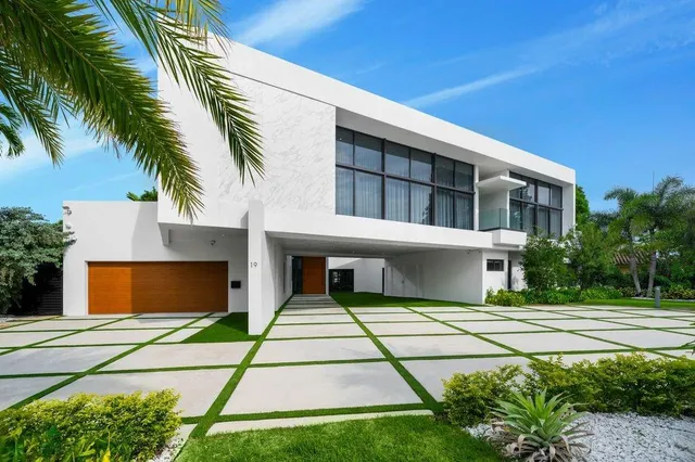 a house with palm tree in front of it