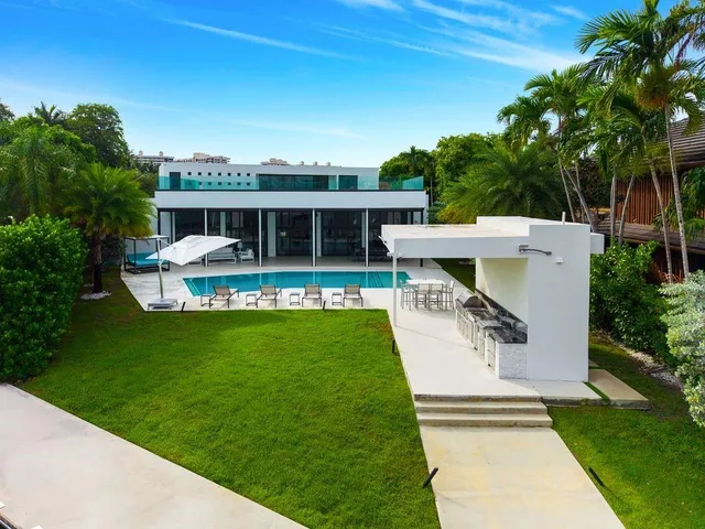 a front view of house with yard and outdoor seating