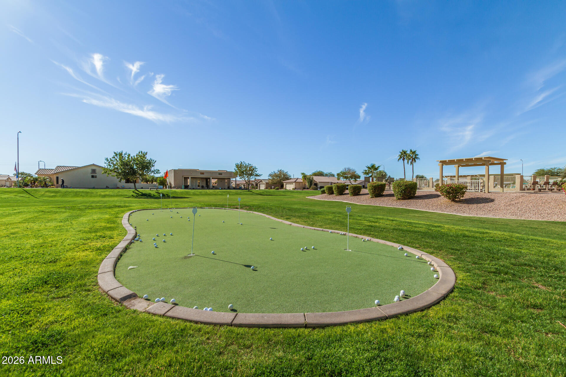 2101 South Meridian Road, Unit 45 Apache Junction, AZ 85120 - Photo 29 of 36 a view of a swimming pool and a yard