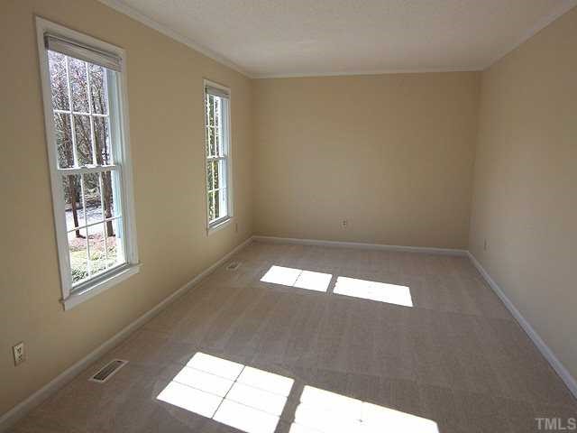 6921 Three Bridges Circle Raleigh, NC 27613 - Photo 2 of 12 a view of empty room with windows