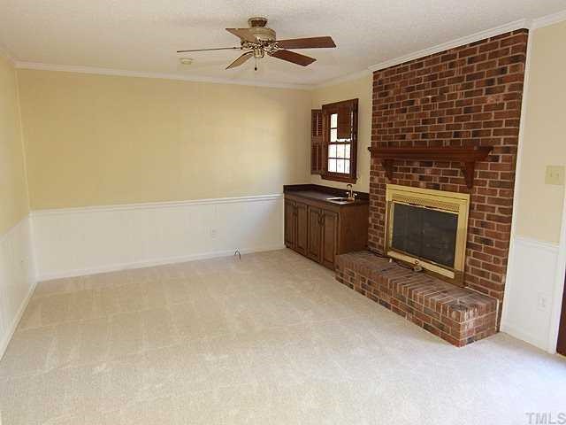 6921 Three Bridges Circle Raleigh, NC 27613 - Photo 6 of 12 a room with a fireplace