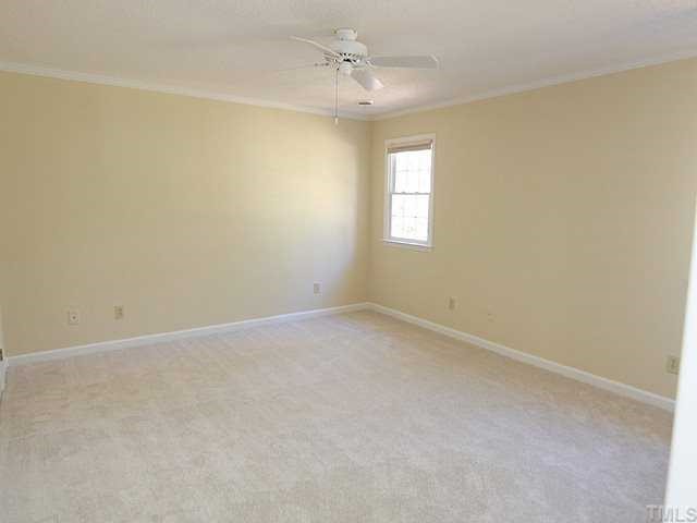 6921 Three Bridges Circle Raleigh, NC 27613 - Photo 7 of 12 an empty room with a window and a ceiling fan